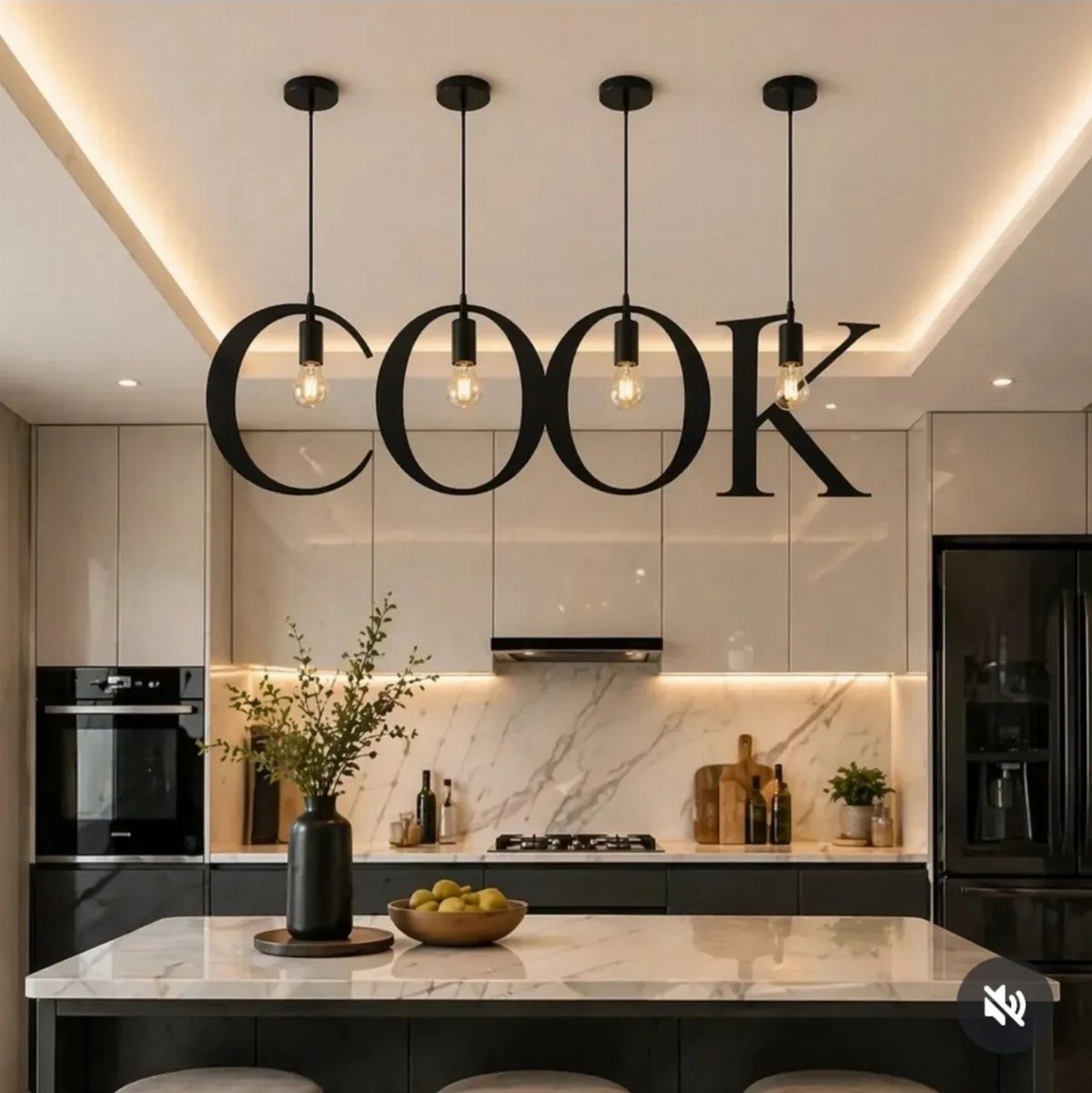 Black pendant lights spelling the word COOK hanging over a modern marble kitchen island.