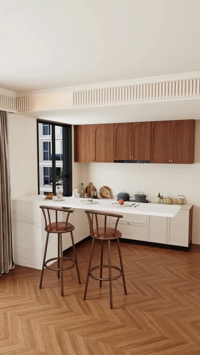 A white minimalist kitchen island with two wooden bar stools on herringbone wood flooring.